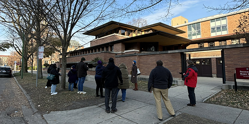 Teaching by Design participants stop alongside Robie House’s exterior to sketch the home.