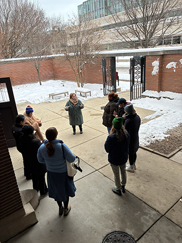 Educators begin their tour outside Frank Lloyd Wright’s Robie House in the Hyde Park neighborhood of Chicago.