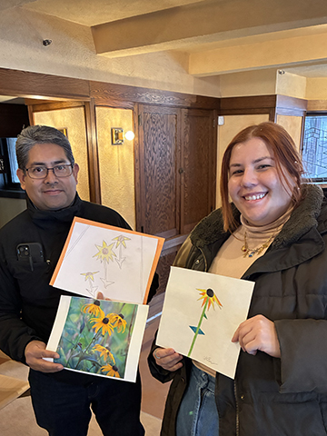 Educators compare geometric drawings of native prairie plants during a workshop about abstraction and the Prairie style. 