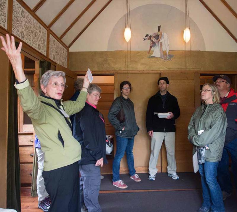 group of tour guests around volunteer interpreter